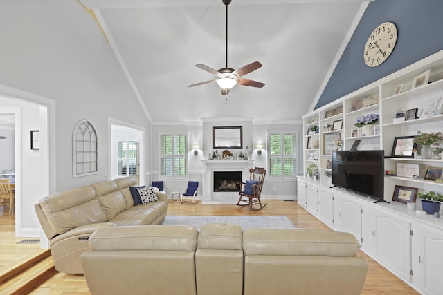 189 Fox Chase Dr, Goose Creek, SC 29445 - living area with high vaulted ceiling, ceiling fan, plenty of natural light, a fireplace, and light wood-style flooring