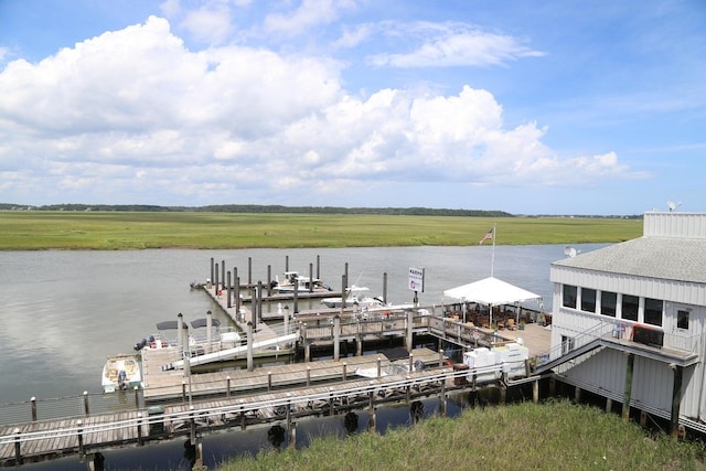 view of dock featuring a water view and a rural view