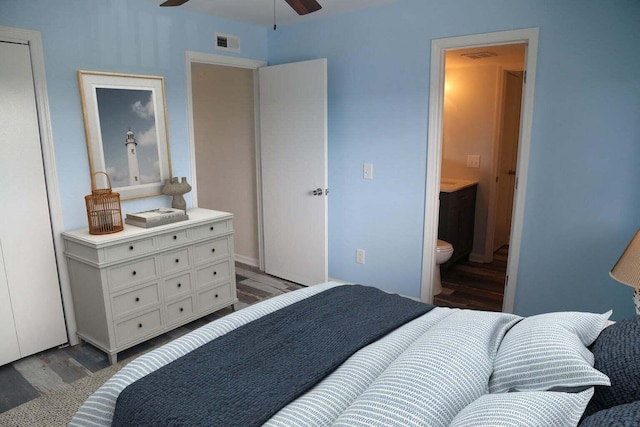 bedroom featuring hardwood / wood-style flooring and ensuite bathroom