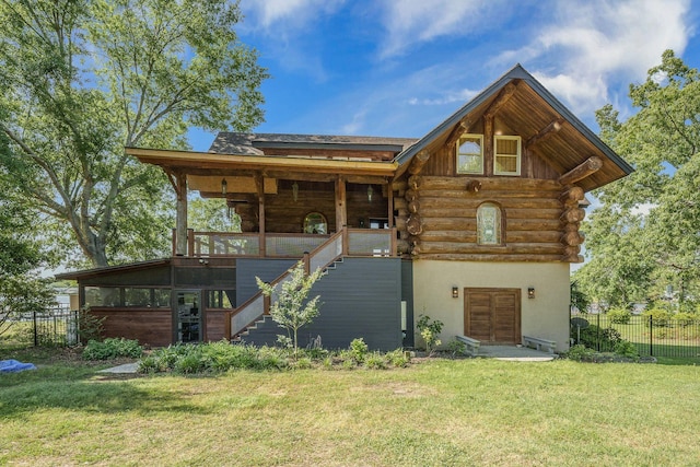 log home with stairway, log siding, and stucco siding