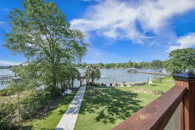 water view featuring a dock and fence