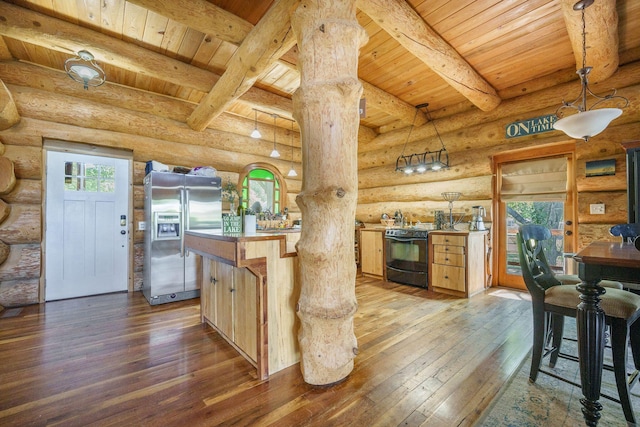 kitchen with stainless steel fridge, wood ceiling, dark wood finished floors, black range with electric stovetop, and plenty of natural light