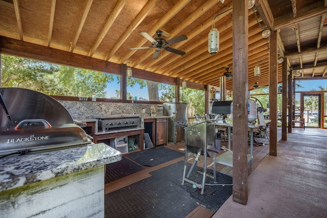 view of patio / terrace featuring area for grilling, grilling area, a ceiling fan, and outdoor dining area