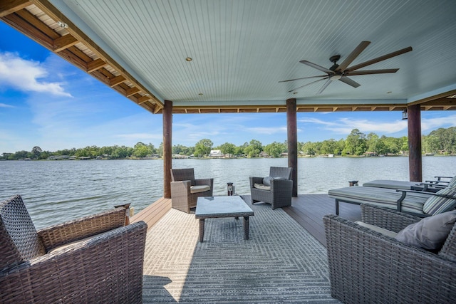 dock with a water view and an outdoor living space