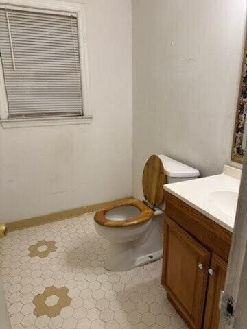 bathroom featuring vanity and toilet