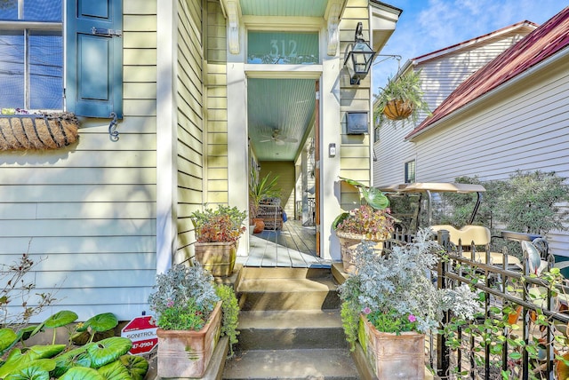 view of exterior entry with covered porch