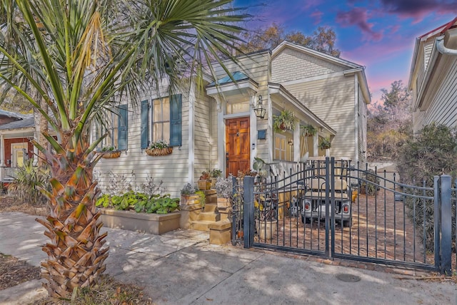 view of front of house featuring a gate and fence