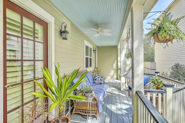 deck featuring a porch and a ceiling fan