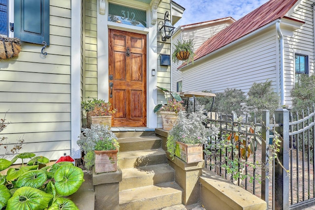 view of exterior entry with metal roof