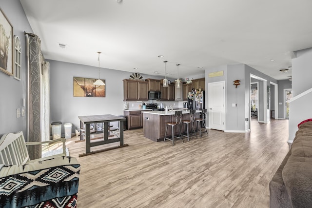 9009 Chato Ct, Summerville, SC 29483 - living room featuring light wood finished floors and baseboards