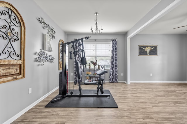 9009 Chato Ct, Summerville, SC 29483 - workout area with wood finished floors, baseboards, and a chandelier