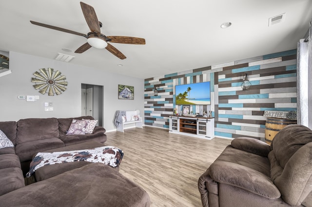 9009 Chato Ct, Summerville, SC 29483 - living area with a ceiling fan, wood finished floors, an accent wall, and baseboards