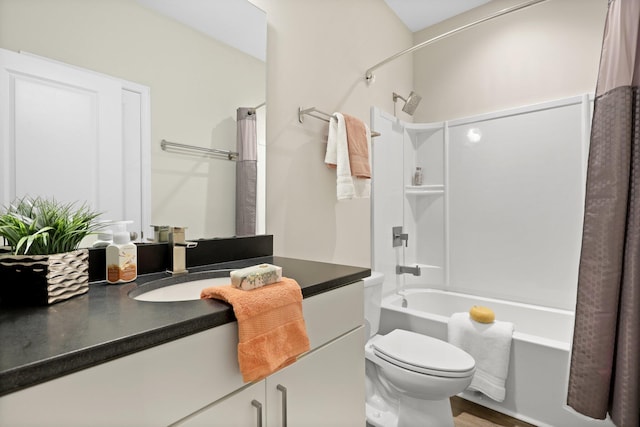 full bath with shower / bath combo with shower curtain, toilet, vanity, and wood finished floors