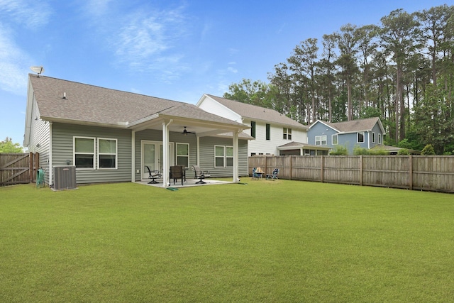 back of house featuring a ceiling fan, a patio area, central AC, and roof with shingles