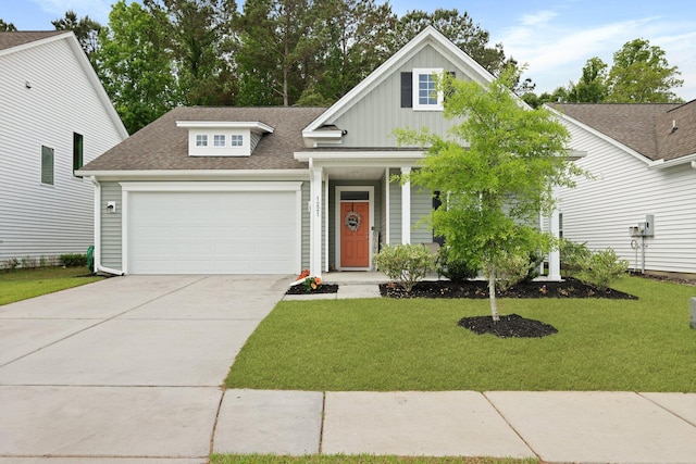 view of front of home featuring board and batten siding, a garage, a shingled roof, a front lawn, and driveway