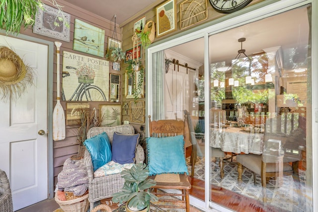 sunroom / solarium featuring a barn door