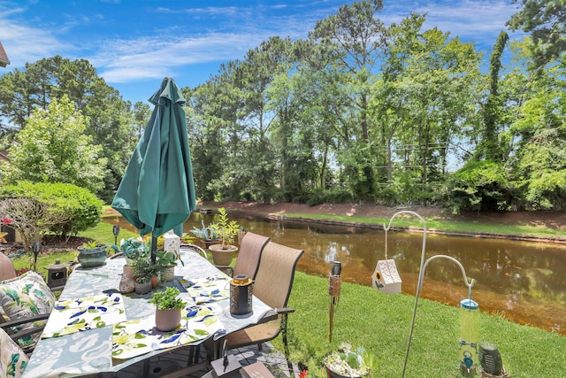 view of yard featuring a patio and a water view