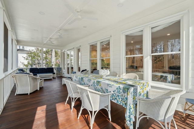 sunroom with a ceiling fan