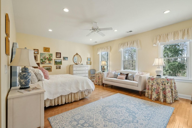 bedroom with recessed lighting, visible vents, ceiling fan, and light wood finished floors