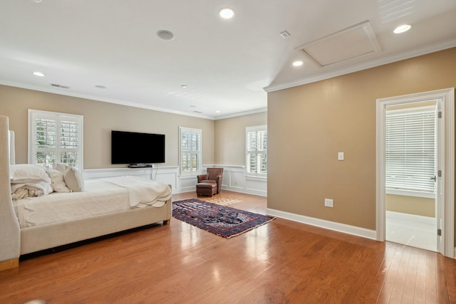 bedroom with attic access, recessed lighting, ornamental molding, and light wood finished floors