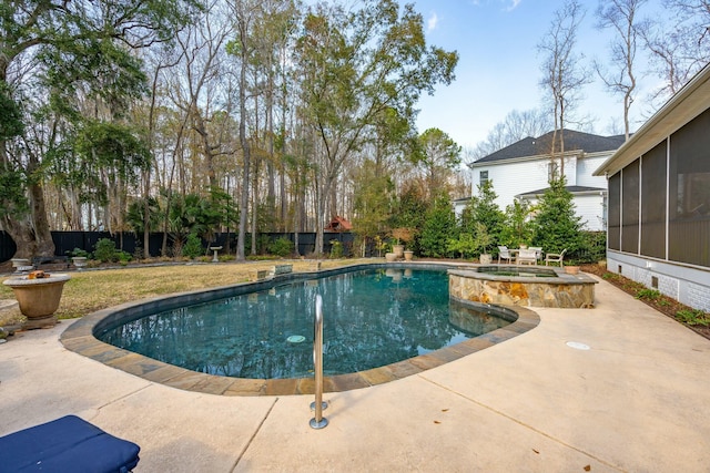 view of swimming pool with a patio area, a sunroom, a fenced backyard, and a pool with connected hot tub