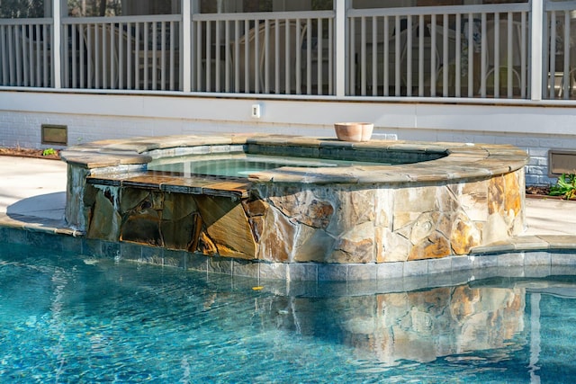 pool with an in ground hot tub