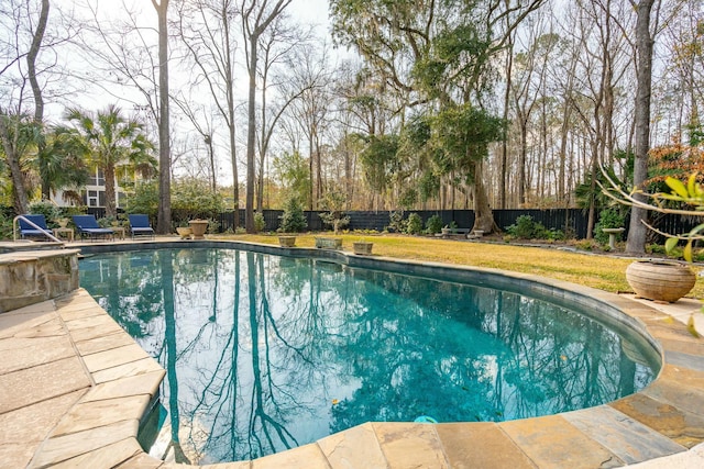 outdoor pool featuring a fenced backyard and a patio