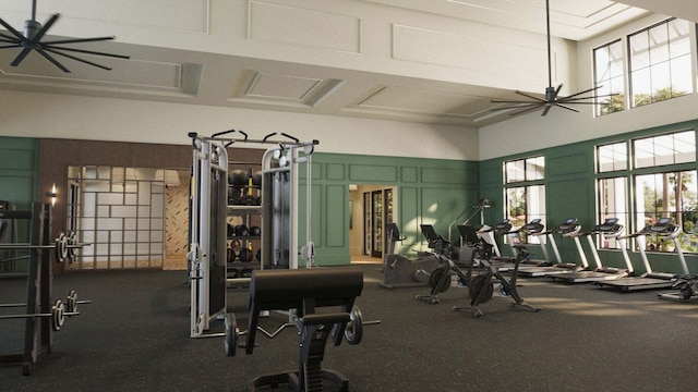 workout area with a high ceiling