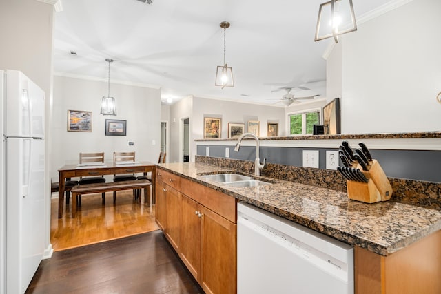 300 Bucksley Ln Unit 102, Charleston, SC 29492 - kitchen featuring white appliances, a sink, crown molding, dark wood finished floors, and dark stone counters