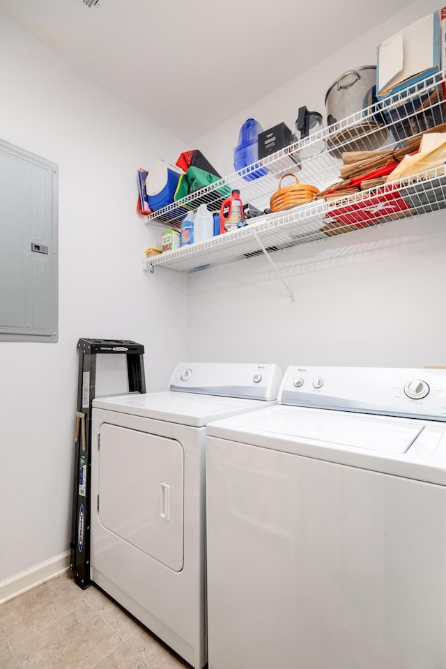 300 Bucksley Ln Unit 102, Charleston, SC 29492 - laundry area with electric panel, washing machine and clothes dryer, baseboards, and light tile patterned floors