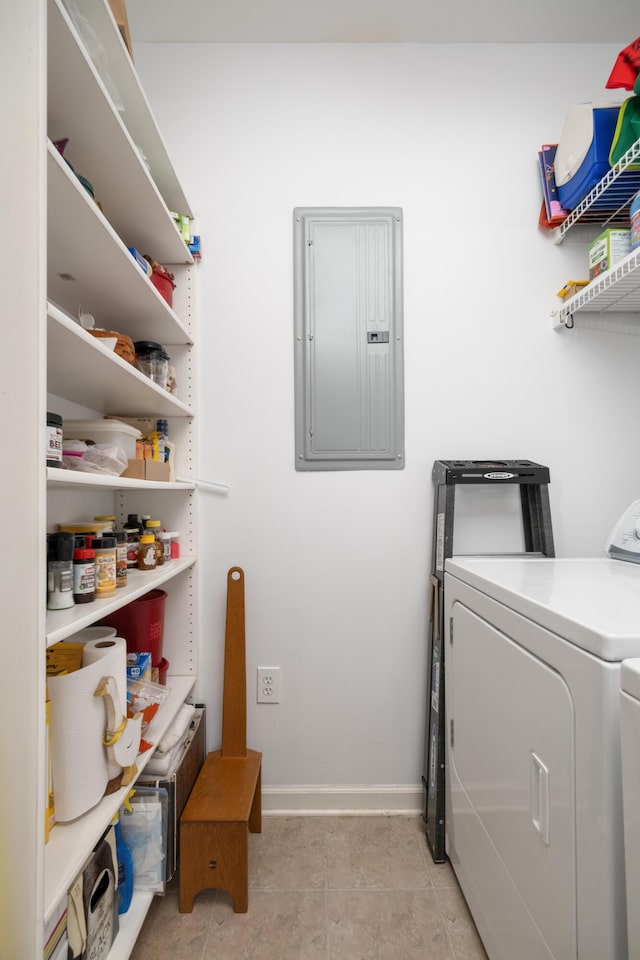 300 Bucksley Ln Unit 102, Charleston, SC 29492 - laundry area featuring electric panel, washing machine and dryer, baseboards, and light tile patterned floors