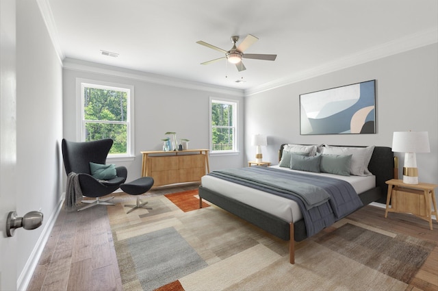 263 Huguenot Trl, Huger, SC 29450 - bedroom with wood finished floors, crown molding, and ceiling fan