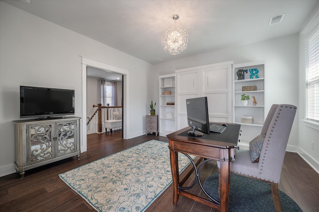 office with dark wood finished floors, baseboards, an inviting chandelier, and visible vents