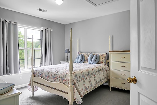 carpeted bedroom with multiple windows and baseboards