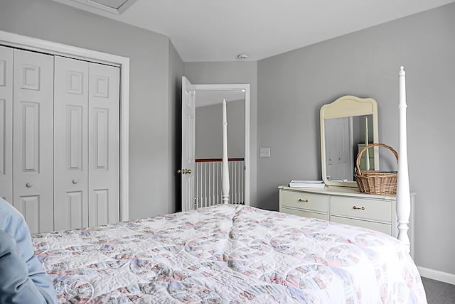 bedroom featuring a closet, carpet, and baseboards