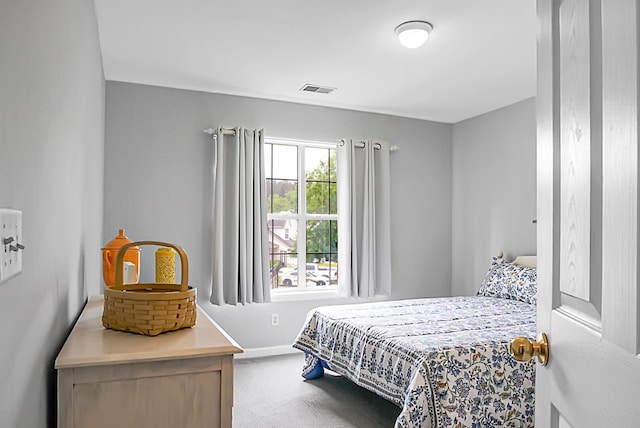 carpeted bedroom featuring baseboards