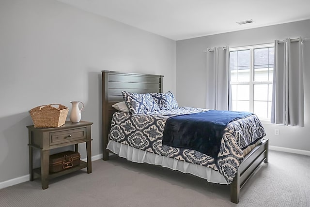 carpeted bedroom featuring baseboards