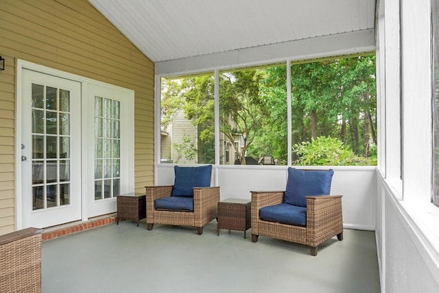 sunroom with lofted ceiling and french doors