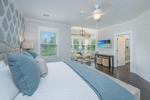 bedroom with wood finished floors, crown molding, baseboards, a ceiling fan, and ensuite bath