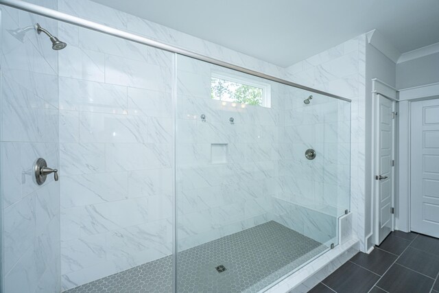bathroom featuring a shower stall and tile patterned flooring