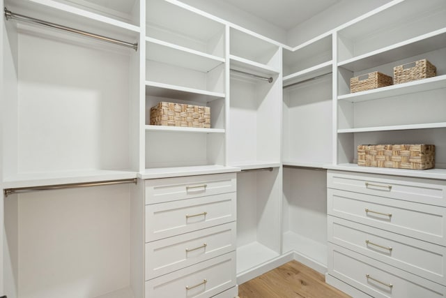 spacious closet with light wood finished floors