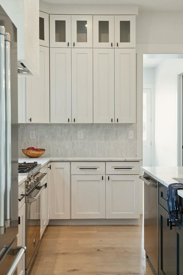 kitchen featuring white cabinets and appliances with stainless steel finishes