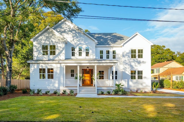 view of front facade with a porch and a front yard