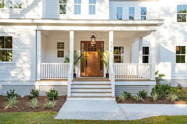 property entrance featuring covered porch