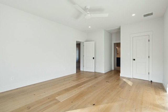 unfurnished room with ceiling fan and light wood-type flooring