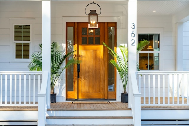 doorway to property with baseboard heating