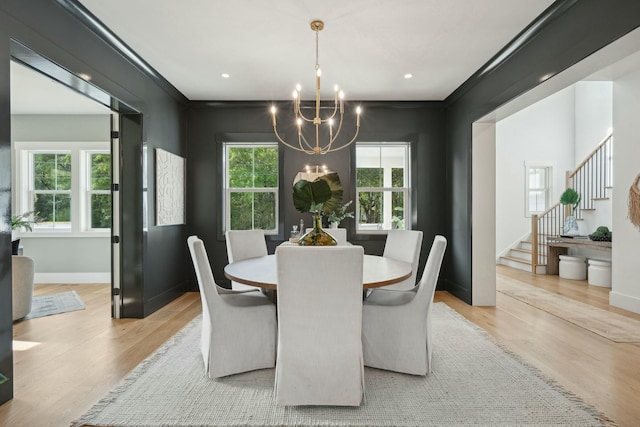dining area with light wood-style floors, recessed lighting, a chandelier, stairway, and baseboards