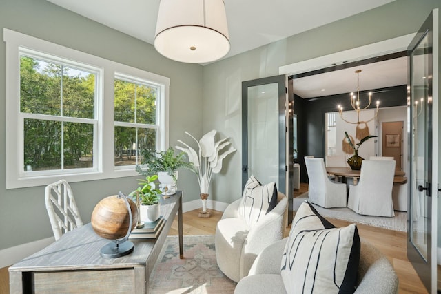 dining room with baseboards and wood finished floors