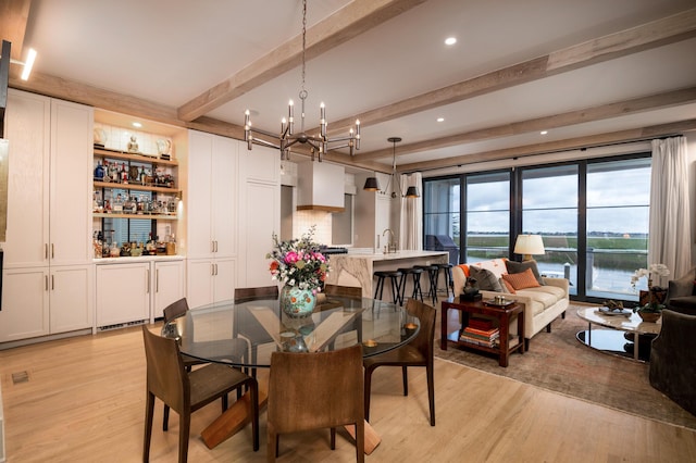 1646 Marsh Harbor Ln, Mount Pleasant, SC 29464 - dining space with a chandelier, light wood-style floors, beam ceiling, a bar, and recessed lighting