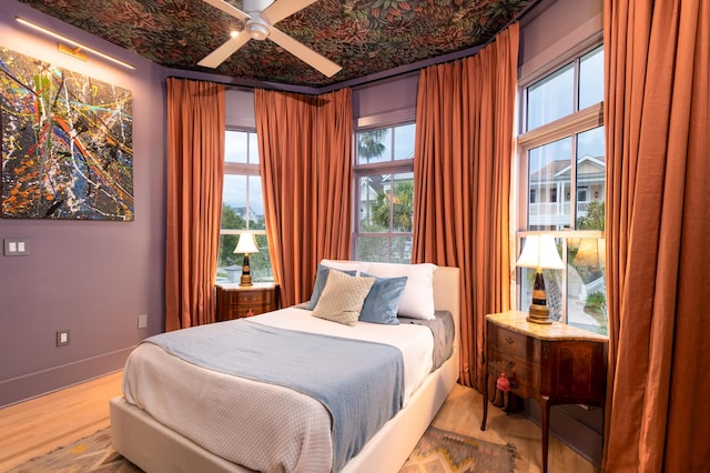 1646 Marsh Harbor Ln, Mount Pleasant, SC 29464 - bedroom with wood finished floors and a ceiling fan